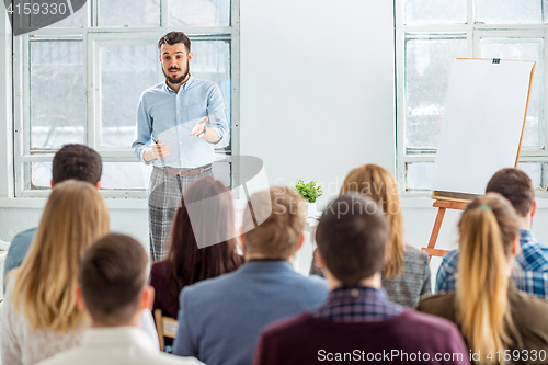 Image of Speaker at Business Meeting in the conference hall.