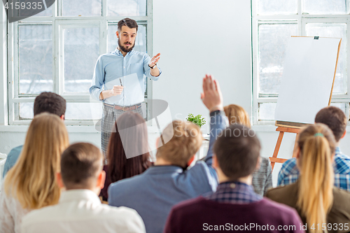 Image of Speaker at Business Meeting in the conference hall.