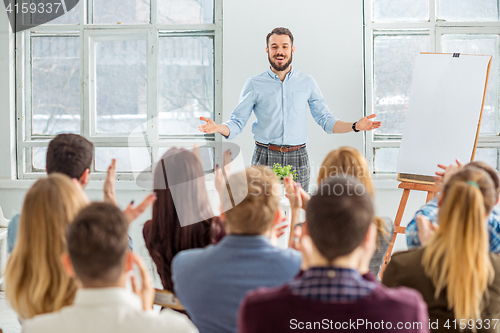 Image of Speaker at Business Meeting in the conference hall.