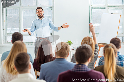 Image of Speaker at Business Meeting in the conference hall.