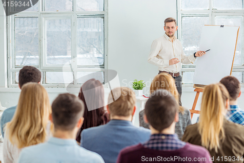 Image of Speaker at Business Meeting in the conference hall.