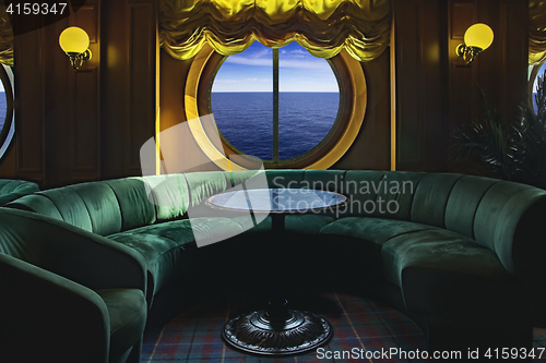 Image of Lounge on a cruise ship, with tables and armchair