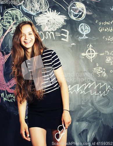 Image of back to school after summer vacations, cute teen girl in classroom