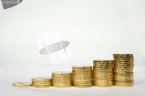 Image of Revenue growth as shown by the example of coins columns