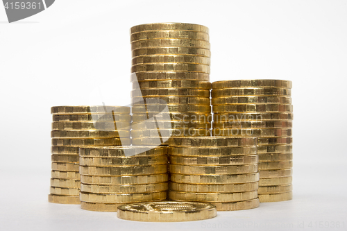 Image of Six stacks of coins increasing in height on a white background