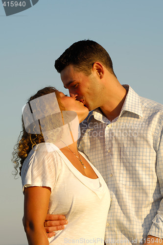 Image of Young couple is kissing