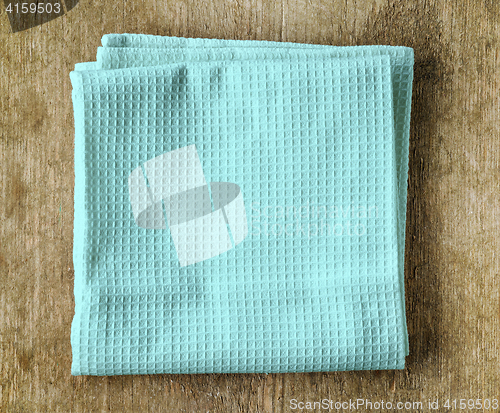 Image of blue towel on wooden table