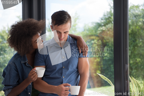 Image of romantic happy young couple relax at modern home indoors