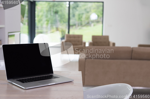 Image of Notebook with blank screen on table