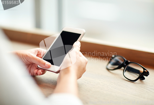 Image of close up of woman texting on smartphone