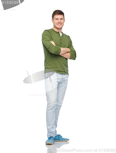 Image of smiling young man over white