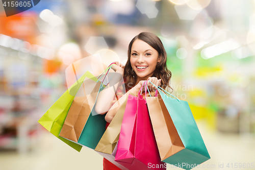 Image of woman with shopping bags at store