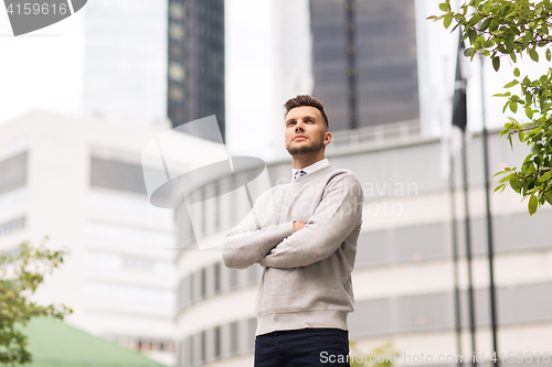 Image of young man on city street