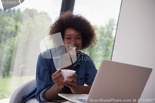 Image of African American woman in the living room