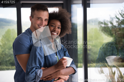 Image of romantic happy young couple relax at modern home indoors