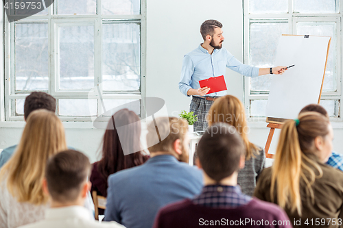 Image of Speaker at Business Meeting in the conference hall.