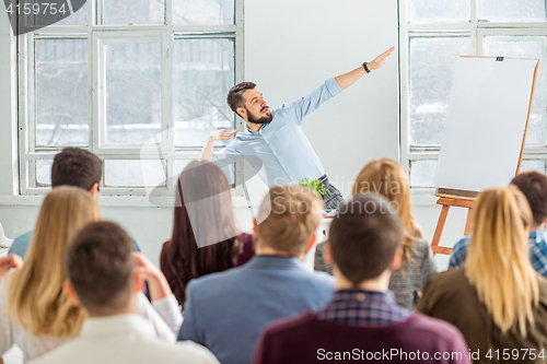 Image of Speaker at Business Meeting in the conference hall.