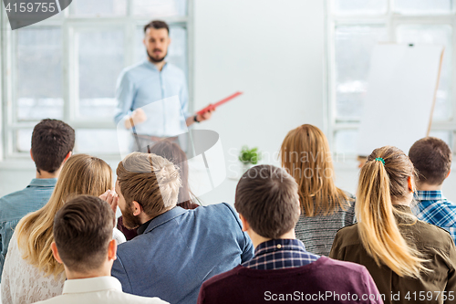 Image of Speaker at Business Meeting in the conference hall.