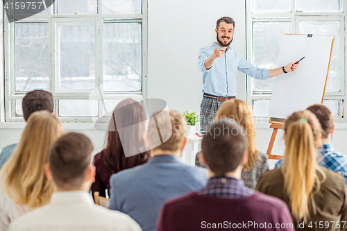 Image of Speaker at Business Meeting in the conference hall.