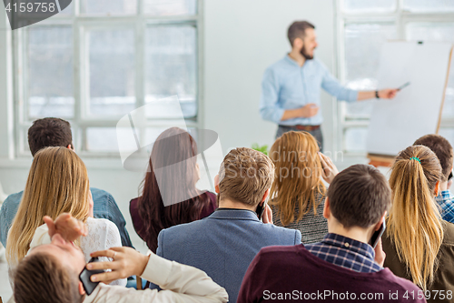 Image of Speaker at Business Meeting in the conference hall.