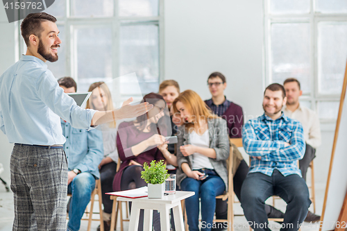 Image of Speaker at Business Meeting in the conference hall.