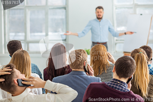 Image of Speaker at Business Meeting in the conference hall.