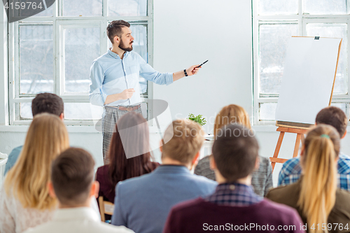 Image of Speaker at Business Meeting in the conference hall.