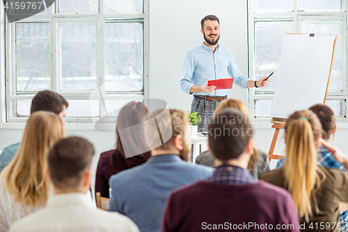 Image of Speaker at Business Meeting in the conference hall.