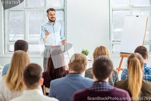 Image of Speaker at Business Meeting in the conference hall.