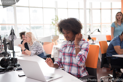 Image of African American informal business woman working in the office