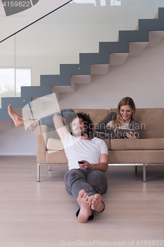 Image of young couple relaxes in the living room