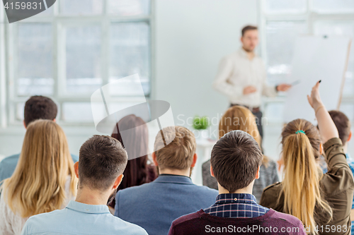 Image of Speaker at Business Meeting in the conference hall.