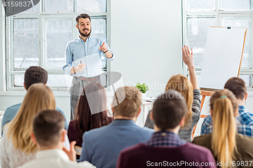 Image of Speaker at Business Meeting in the conference hall.