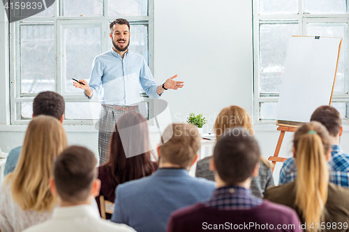 Image of Speaker at Business Meeting in the conference hall.