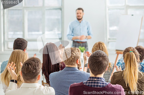 Image of Speaker at Business Meeting in the conference hall.