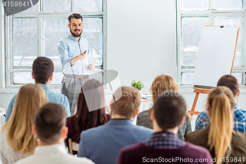 Image of Speaker at Business Meeting in the conference hall.