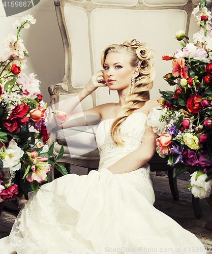 Image of beauty young bride alone in luxury vintage interior with flowers