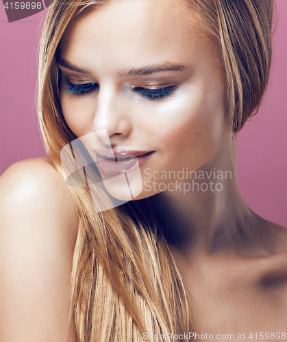 Image of young pretty blonde woman with hairstyle close up