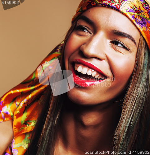 Image of beauty young happy afro american woman in shawl on head