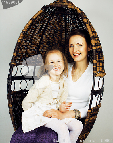 Image of young mother with daughter at home interior