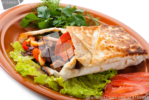 Image of beef fajitas with peppers and tomato