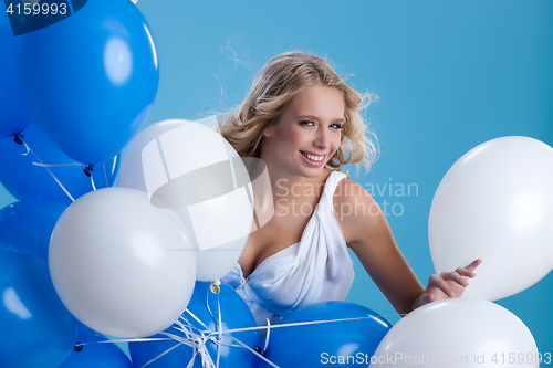 Image of Young Woman With Balloons