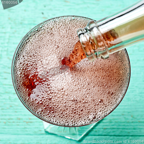 Image of glass of red champagne