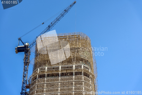 Image of Construction of skyscrapers under blue sky