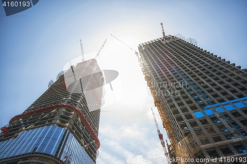 Image of Construction of skyscrapers under blue sky