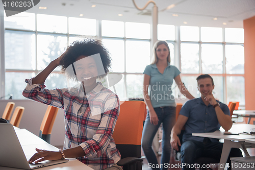 Image of African American informal business woman working in the office