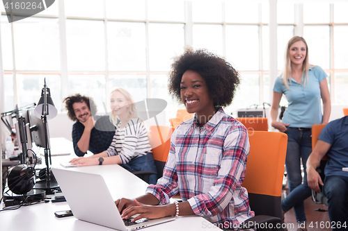 Image of African American informal business woman working in the office