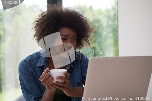 Image of African American woman in the living room