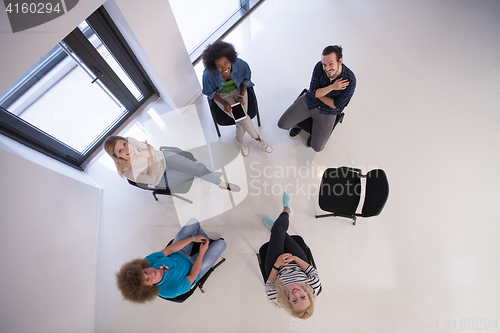 Image of Multiethnic startup business team on meeting  top view