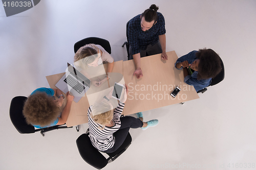 Image of Multiethnic startup business team on meeting  top view